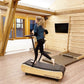 Young woman running on soft wooden treadmill, barefoot treadmill Walkolution Germany