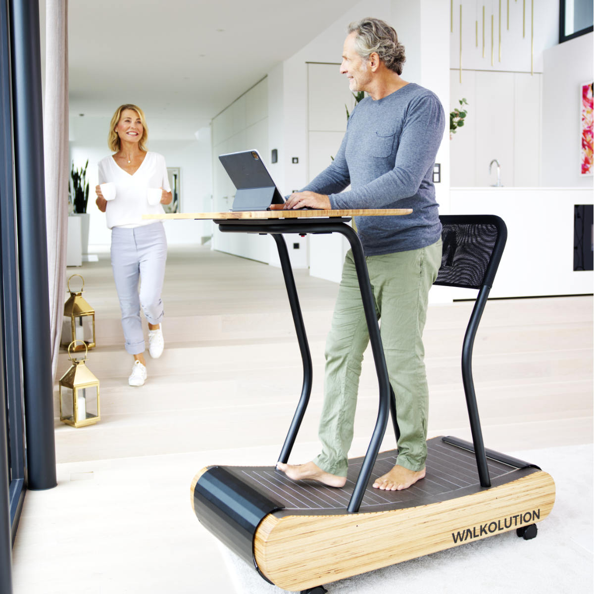 Man using treadmill desk in home office Walkolution Germany